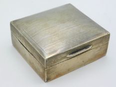 A 1929 Birmingham silver cigarette box with machin