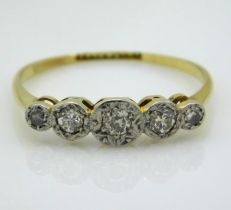 An 18ct gold ring with platinum mounted illusion s