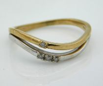 A two colour, 9ct gold double layer ring set with