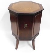 A late 20thC. Strongbow octagonal drinks cabinet with leather style top, a couple of light scuffs to