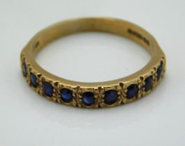 A 9ct gold half eternity ring set with sapphire, 2
