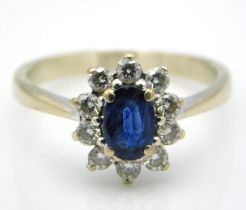 A white gold ring set with sapphire & approx. 0.2ct diamond, main stone 6.25mm x 4.25mm, tests elect