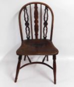 An 18thC. elm seated chair with crinoline stretche