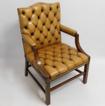 A tan button back leather Gainsborough chair, heig