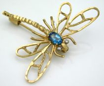 A yellow metal dragonfly brooch set with topaz & s