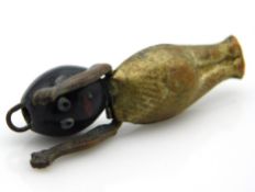 An antique charm pendant with Africana bean head,