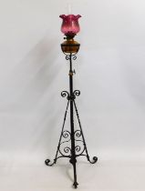 An antique rise & fall lamp with cranberry shade,