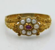 A Victorian yellow metal ring set with pearl & rub