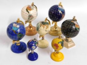 Seven small mineral globes, tallest 6.25in