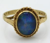 A 9ct gold ring set with black opal doublet, 2.4g,