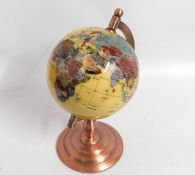 A revolving mineral globe, 16in high