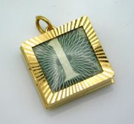 A 9ct gold pendant with one pound note inside, 21m