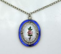 A floral Charles Horner silver enamel pendant with