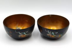 A pair of Chinese lacquerware dishes decorated wit
