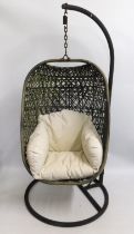 A garden 'egg' chair with cushion, 78in high