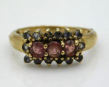 A 9ct gold ring set with white & pink stones, 2.7g