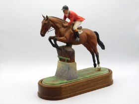 A Royal Worcester porcelain horse & rider group titled 'Fox Hunter & Lt. Col. H.M. Llewellyn CBE, 12
