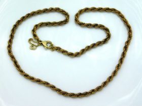 A 19in long 9ct gold rope chain with safety lock,