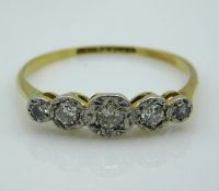An 18ct gold ring with platinum mounted illusion s
