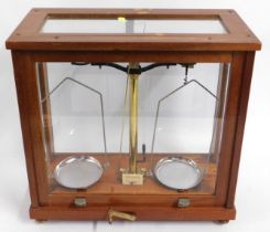 A mahogany cased set of balance scales, 14.875in h