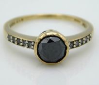 A 9ct gold ring set with approx. 0.75ct black diam