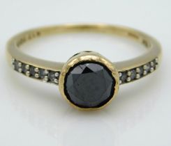 A 9ct gold ring set with approx. 0.75ct black diam