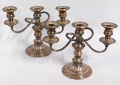 A pair of silver plated candelabra, 10.75in wide x 7.75in tall