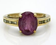 A 9ct gold amethyst ring with pink/red stone & pave set white stones, small chip to main stone, 3.6g
