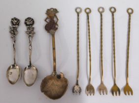 An .800 silver gilt spoon of organic design, two .800 silver spoons with rose decor & five gilt cock