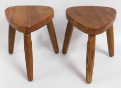 A pair of Peter Marshall elm milking stools, 11.25