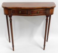 A two drawer walnut hall table, 31in wide x 28.5in