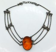 A cased silver mounted amber necklace, maker B.P,