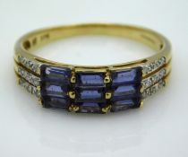 A 9ct gold ring set with small diamonds & blue pas