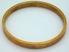 A 9ct rose gold bangle by Payton, Pepper & Sons Lt