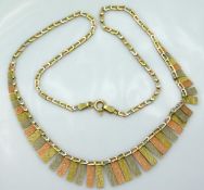 A 16in long 9ct three colour gold Cleopatra neckla