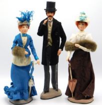 Three papier-mâché figures in period dress, talles