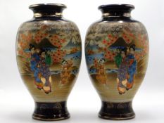 A pair of figurative Satsuma vases, 12.5in tall