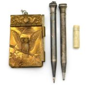 A gilt note pad with owl decor, two Eversharp silv