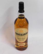 A bottle of Knockando single malt Scotch whisky, d