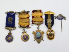 Four silver 1930's masonic medals & one pin award to 'brother A. E. Ebling'