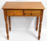 A pine hall table/desk with two drawers, 31.875in