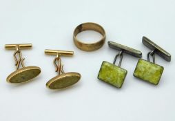 A pair of yellow metal cufflinks with stone settin