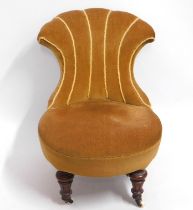 A 19thC. low level slipper chair, 25in high to bac