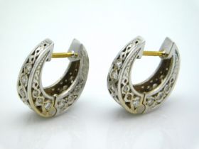 A pair of 18ct white gold horseshoe shaped earring