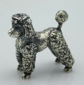 A 1976 London silver poodle by S.M.C, 17.6g
