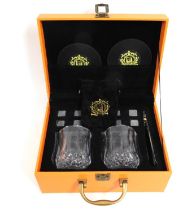 A cased whisky stones & tumbler set