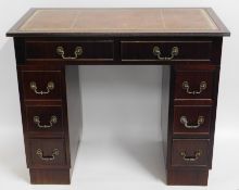 A small mahogany knee hole desk, 35.5in wide x 29.