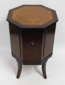 A 20thC. Strongbow octagonal drinks cabinet with l