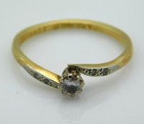 An 18ct gold ring with small platinum set diamond,