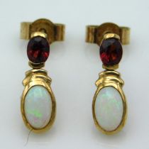 A pair of 9ct gold earrings set with garnet & opal